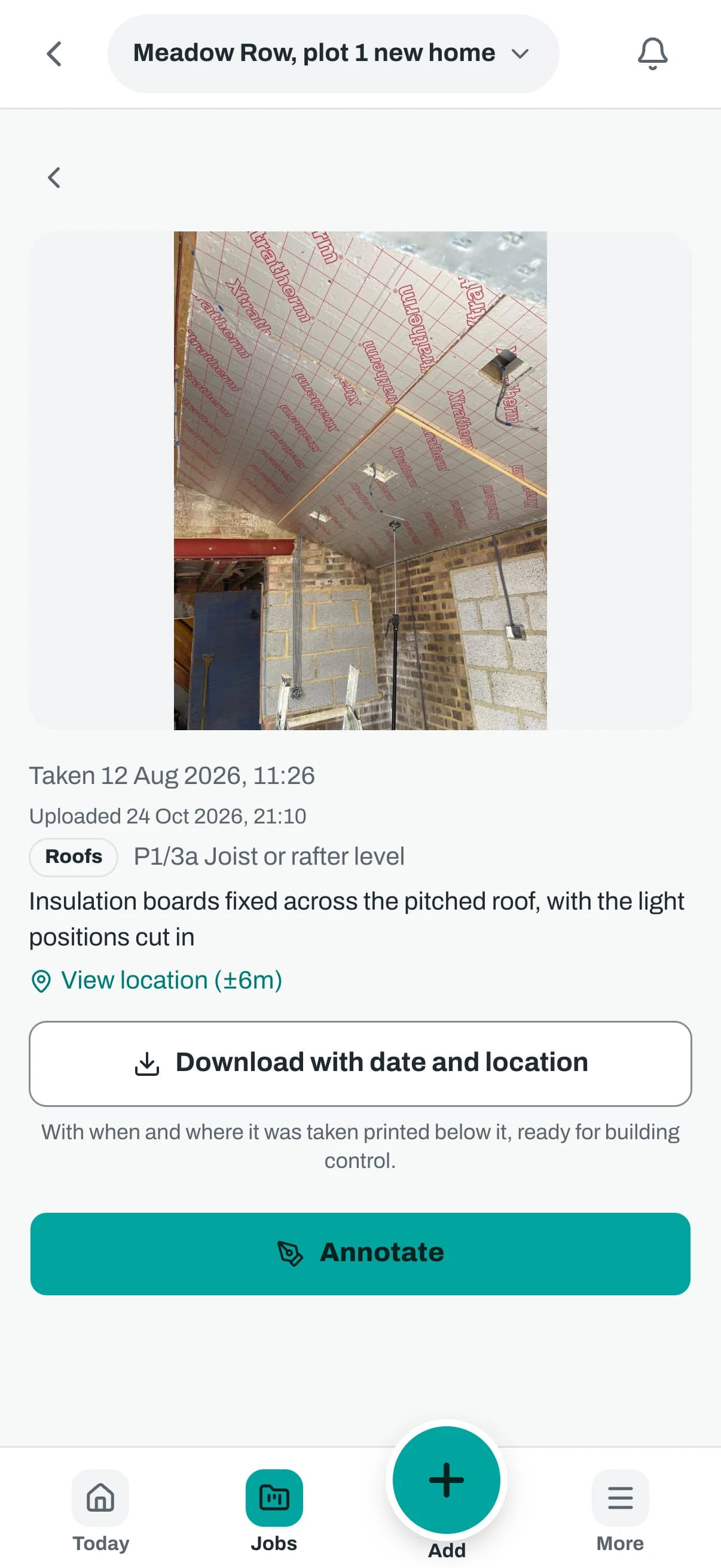 The same photo on a phone, with the time taken, the reference, a link to view the location and a button to download it with date and location.